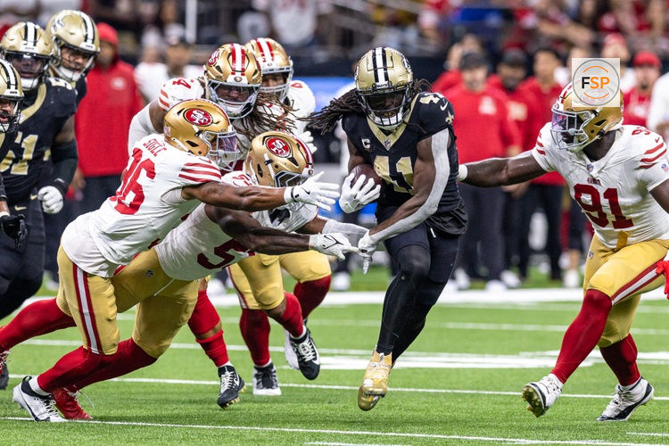 Sep 14, 2025; New Orleans, Louisiana, USA;  New Orleans Saints running back Alvin Kamara (41) runs against the San Francisco 49ers defense during the second half at Caesars Superdome. Credit: Stephen Lew-Imagn Images