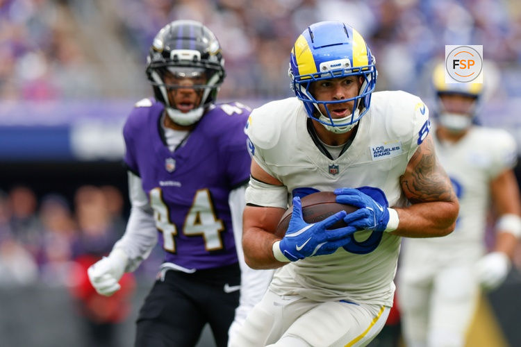 Oct 12, 2025; Baltimore, Maryland, USA; Los Angeles Rams tight end Tyler Higbee (89) carries the ball against the Baltimore Ravens during the second quarter of the game at M&T Bank Stadium. Credit: Peter Casey-Imagn Images