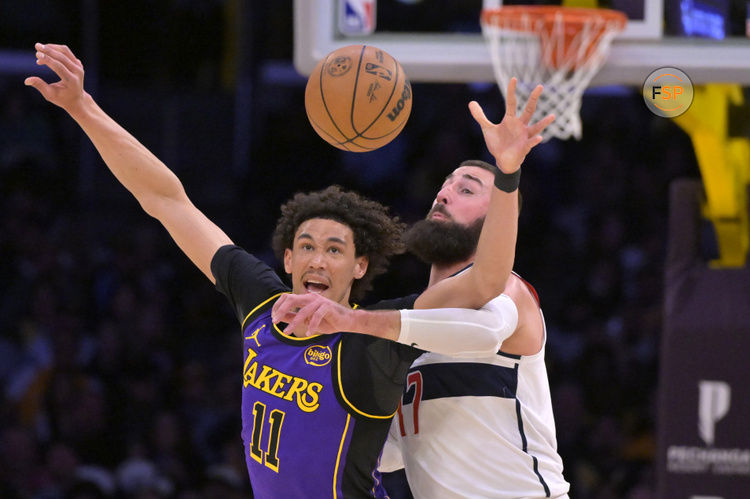 Jan 21, 2025; Los Angeles, California, USA;  Los Angeles Lakers center Jaxson Hayes (11) and Washington Wizards center Jonas Valanciunas (17) reach for a pass in the first half at Crypto.com Arena. Credit: Jayne Kamin-Oncea-Imagn Images