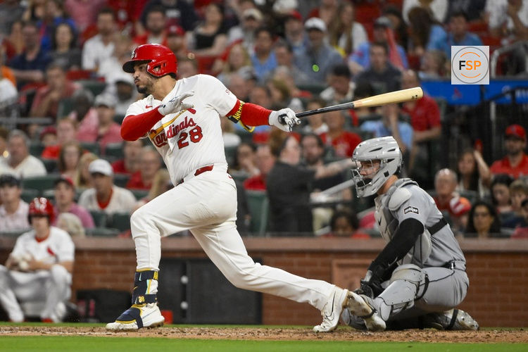 May 19, 2025; St. Louis, Missouri, USA;  St. Louis Cardinals third baseman Nolan Arenado (28) drives in a run against the Detroit Tigers during the fifth inning at Busch Stadium. Credit: Jeff Curry-Imagn Images
