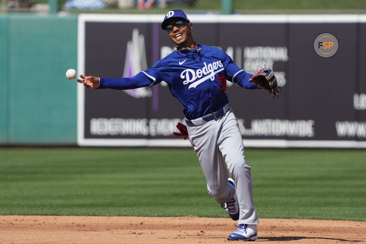 Mar 2, 2025; Mesa, Arizona, USA; Los Angeles Dodgers shortstop Mookie Betts (50) makes the play for an out against the Oakland Athletics in the third inning at Hohokam Stadium. Credit: Rick Scuteri-Imagn Images