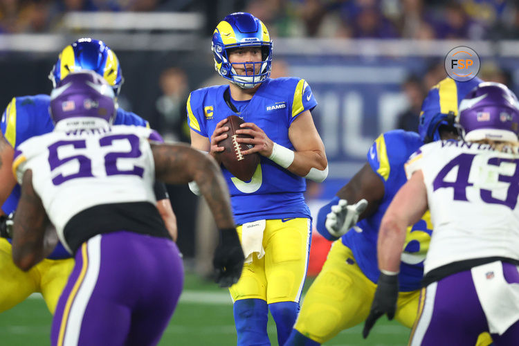 Jan 13, 2025; Glendale, AZ, USA; Los Angeles Rams quarterback Matthew Stafford (9) drops back to pass against the Minnesota Vikings during the second half in an NFC wild card game at State Farm Stadium. Credit: Mark J. Rebilas-Imagn Images