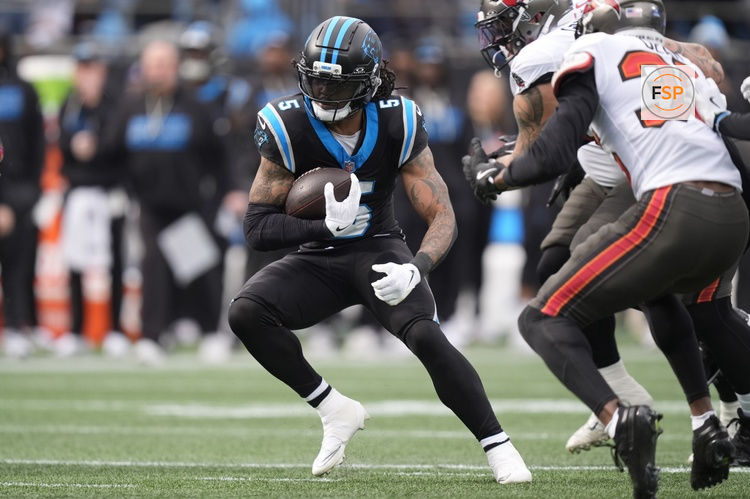 Dec 21, 2025; Charlotte, North Carolina, USA; Carolina Panthers running back Rico Dowdle (5) runs during the first half against the Tampa Bay Buccaneers at Bank of America Stadium. Credit: Jim Dedmon-Imagn Images