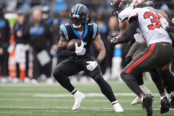 Dec 21, 2025; Charlotte, North Carolina, USA; Carolina Panthers running back Rico Dowdle (5) runs during the first half against the Tampa Bay Buccaneers at Bank of America Stadium. Mandatory Credit: Jim Dedmon-Imagn Images