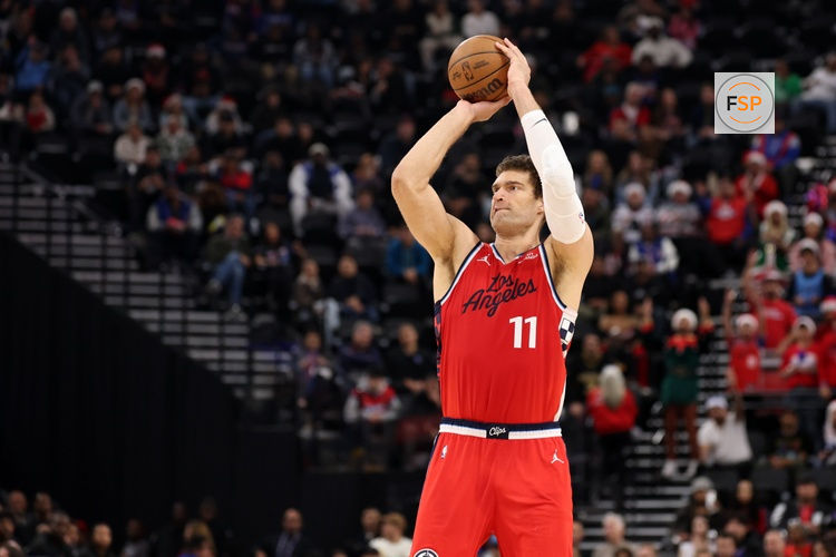 Dec 23, 2025; Inglewood, California, USA;  Los Angeles Clippers center Brook Lopez (11) shoots the ball during the first half against the Houston Rockets at Intuit Dome. Credit: Kiyoshi Mio-Imagn Images