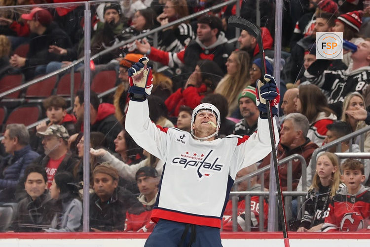Dec 27, 2025; Newark, New Jersey, USA; Washington Capitals defenseman Jakob Chychrun (6) celebrates his game winning goal against the New Jersey Devils in overtime at Prudential Center. Credit: Ed Mulholland-Imagn Images