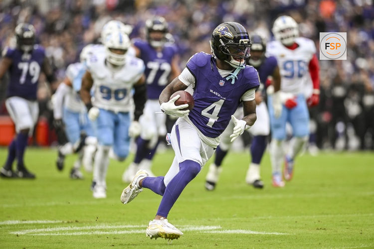 Oct 4, 2026; Baltimore, Maryland, USA;    Baltimore Ravens wide receiver Zay Flowers (4) runs after a catch for a first half touchdown against the Tennessee Titans at M&T Bank Stadium. Credit: Tommy Gilligan-Imagn Images