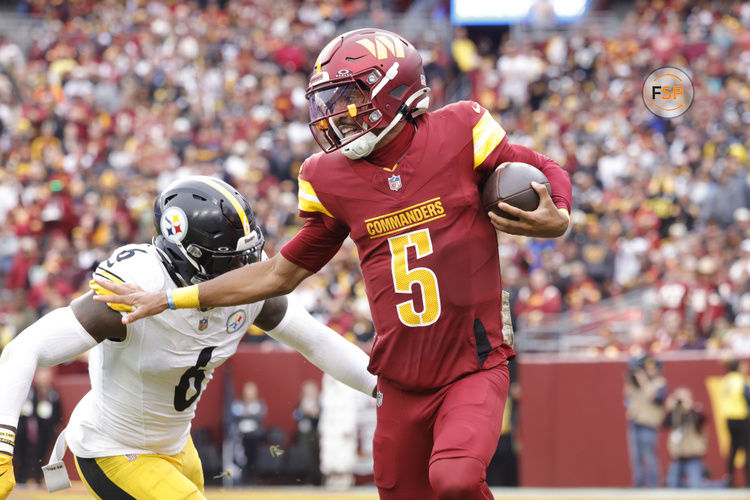 Nov 10, 2024; Landover, Maryland, USA; Washington Commanders quarterback Jayden Daniels (5) carries the ball as Pittsburgh Steelers linebacker Patrick Queen (6) defends during the first half at Northwest Stadium. Credit: Amber Searls-Imagn Images