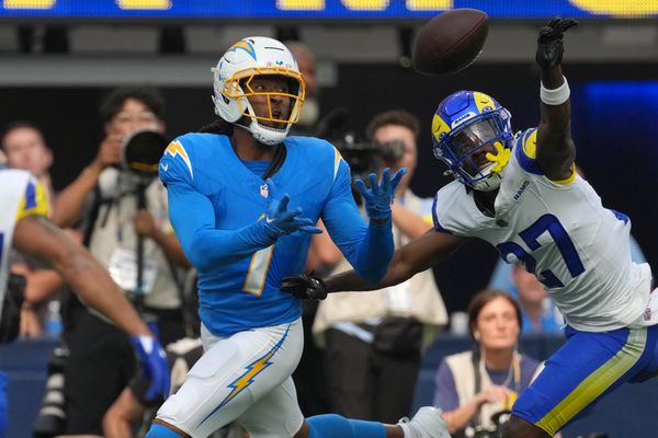Aug 16, 2025; Inglewood, California, USA; Los Angeles Chargers wide receiver Quentin Johnston (1) attempts to make a catch against Los Angeles Rams cornerback A.J. Green (27) in the first half at SoFi Stadium. Mandatory Credit: Kirby Lee-Imagn Images