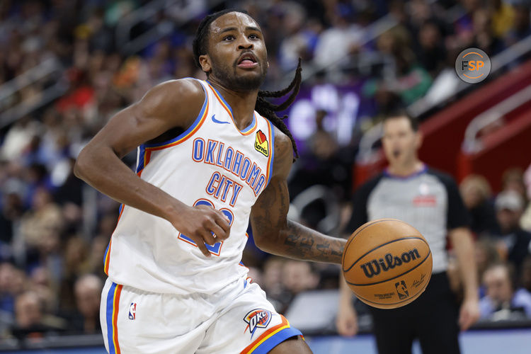 Mar 15, 2025; Detroit, Michigan, USA;  Oklahoma City Thunder guard Cason Wallace (22) dribbles in the second half against the Detroit Pistons at Little Caesars Arena. Credit: Rick Osentoski-Imagn Images