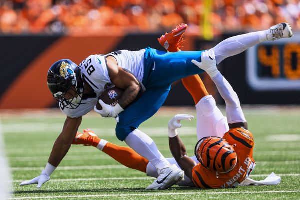 Sep 14, 2025; Cincinnati, Ohio, USA; Cincinnati Bengals linebacker Demetrius Knight Jr. (44) brings down Jacksonville Jaguars tight end Brenton Strange (85) in the second half at Paycor Stadium. Mandatory Credit: Katie Stratman-Imagn Images