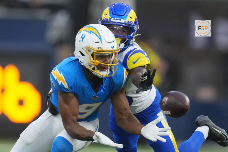 Aug 16, 2025; Inglewood, California, USA; Los Angeles Chargers wide receiver Tre Harris (9) catches the ball against Los Angeles Rams cornerback Cam Lampkin (33) in the secnd half at SoFi Stadium. Credit: Kirby Lee-Imagn Images