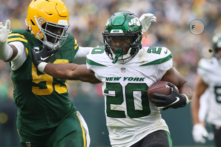 GREEN BAY, WI - OCTOBER 16: New York Jets running back Breece Hall (20) stiff arms his way into the end zone during a game between the Green Bay Packers and the New York Jets at Lambeau Field on October 16, 2022 in Green Bay, WI. (Photo by Larry Radloff/Icon Sportswire)