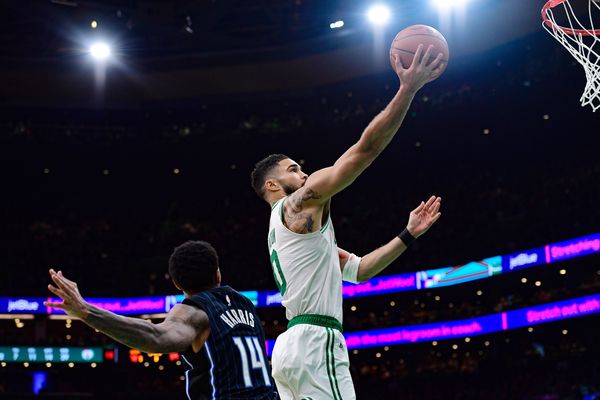 Apr 20, 2025; Boston, Massachusetts, USA; Boston Celtics forward Jayson Tatum (0) drives to the basket past Orlando Magic guard Gary Harris (14) during the second half at TD Garden. Mandatory Credit: Bob DeChiara-Imagn Images