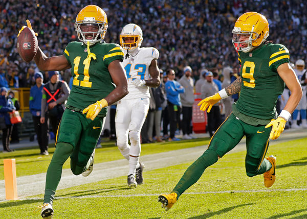 Aug 10, 2024; Cleveland, Ohio, USA; Green Bay Packers quarterback Jordan Love (10) hand the ball off to running back Josh Jacobs (8) during the first quarter against the Cleveland Browns at Cleveland Browns Stadium. Mandatory Credit: Scott Galvin-USA TODAY Sports