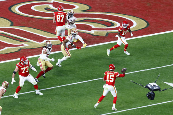 LAS VEGAS, NV - FEBRUARY 11: Kansas City Chiefs quarterback Patrick Mahomes (15) throws the game winning touchdown in overtime to Kansas City Chiefs wide receiver Mecole Hardman (12) during Super Bowl LVIII between the Kansas City Chiefs and the San Francisco 49ers on February 11, 2024, at Allegiant Stadium in Las Vegas, NV. (Photo by Jeff Speer/Icon Sportswire)