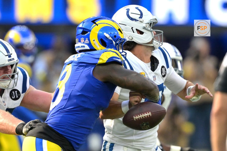 Sep 28, 2025; Inglewood, California, USA; Los Angeles Rams linebacker Jared Verse (8) forces a fumble by Indianapolis Colts quarterback Daniel Jones (17) in the fourth quarter at SoFi Stadium. Credit: Jayne Kamin-Oncea-Imagn Images