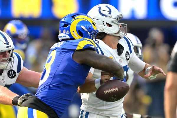 Sep 28, 2025; Inglewood, California, USA; Los Angeles Rams linebacker Jared Verse (8) forces a fumble by Indianapolis Colts quarterback Daniel Jones (17) in the fourth quarter at SoFi Stadium. Mandatory Credit: Jayne Kamin-Oncea-Imagn Images