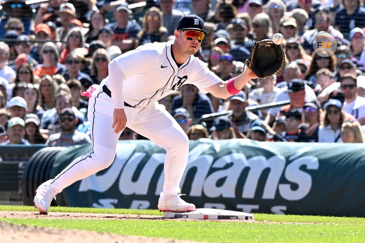 May 11, 2025; Detroit, Michigan, USA; Detroit Tigers first baseman Spencer Torkelson (20) takes a throw from pitcher Brant Hurter (not pictured) to make a put out against the Texas Rangers in the eighth inning at Comerica Park. Credit: Lon Horwedel-Imagn Images