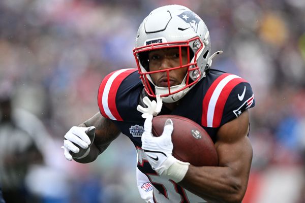 Sep 7, 2025; Foxborough, Massachusetts, USA; New England Patriots running back TreVeyon Henderson (32) ruswhes the ball against the Las Vegas Raiders in the first half at Gillette Stadium. Mandatory Credit: Brian Fluharty-Imagn Images