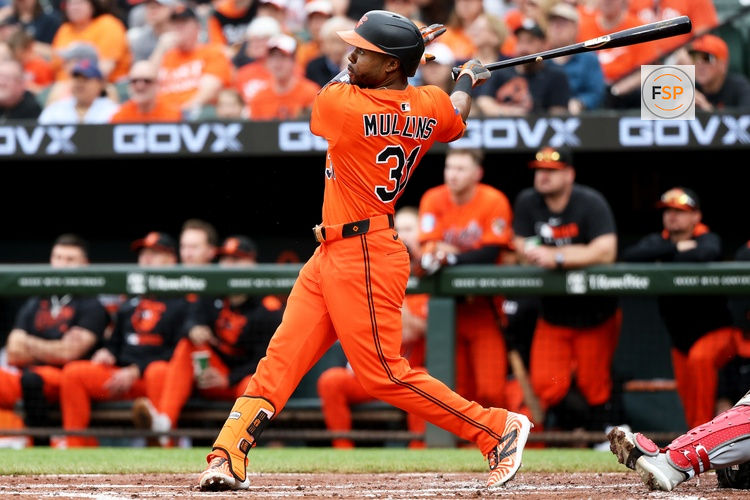Apr 19, 2025; Baltimore, Maryland, USA; Baltimore Orioles outfielder Cedric Mullins (31) hits a home run during the first inning against the Cincinnati Reds at Oriole Park at Camden Yards. Credit: Daniel Kucin Jr.-Imagn Images