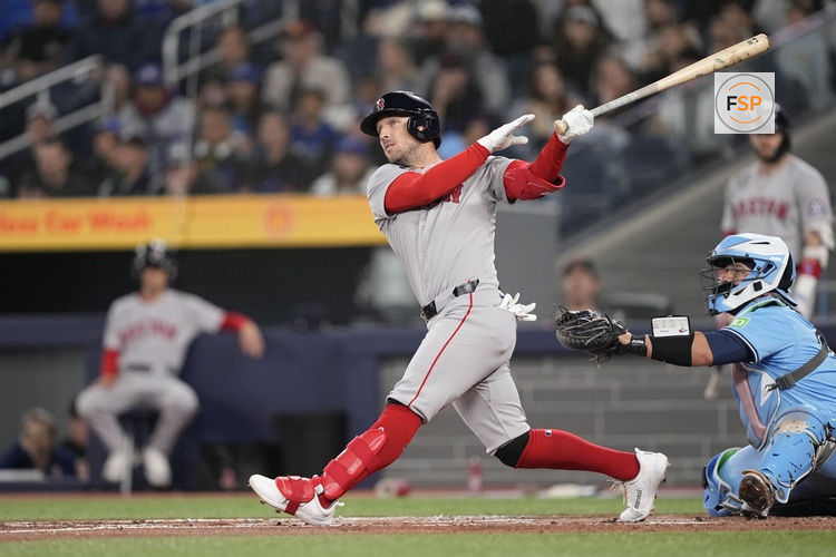 Apr 30, 2025; Toronto, Ontario, CAN; Boston Red Sox third baseman Alex Bregman (2) hits a solo home run against the Toronto Blue Jays during the first inning at Rogers Centre. Credit: John E. Sokolowski-Imagn Images
