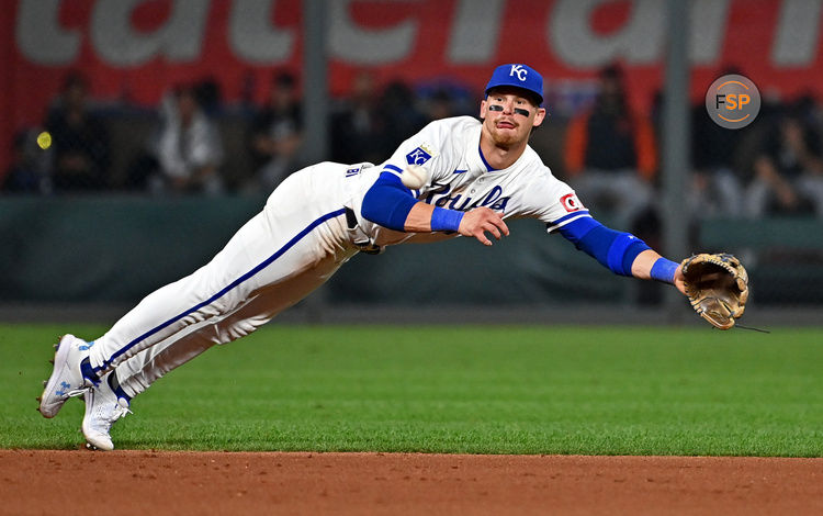 Sep 18, 2024; Kansas City, Missouri, USA;  Kansas City Royals shortstop Bobby Witt Jr. (7) dives for the ball in the seventh inning against the Detroit Tigers at Kauffman Stadium. Credit: Peter Aiken-Imagn Images