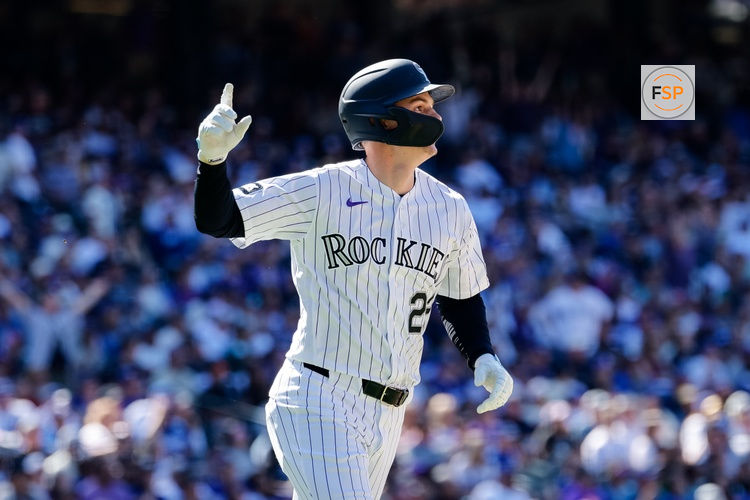 Apr 19, 2026; Denver, Colorado, USA; Colorado Rockies left fielder Mickey Moniak (22) gestures on a solo home run in the seventh inning against the Los Angeles Dodgers at Coors Field. Credit: Isaiah J. Downing-Imagn Images