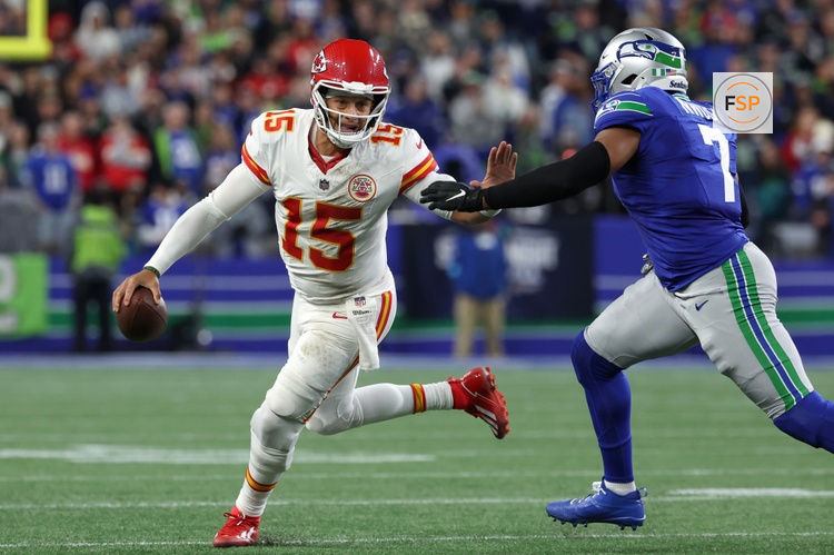 Oct 25, 2026; Seattle, Washington, USA;  Kansas City Chiefs quarterback Patrick Mahomes (15) scrambles with the ball under pressure from Seattle Seahawks linebacker Uchenna Nwosu (7) during the third quarter at Lumen Field.  Credit: Joe Nicholson-Imagn Images