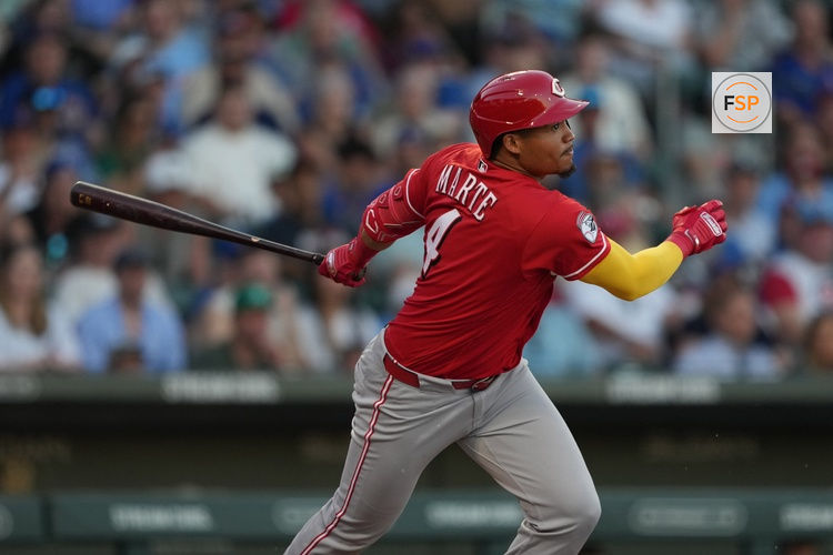 Mar 20, 2026; Mesa, Arizona, USA; Cincinnati Reds outfielder Noelvi Marte (4) hits against the Chicago Cubs in the second inning at Sloan Park. Credit: Rick Scuteri-Imagn Images