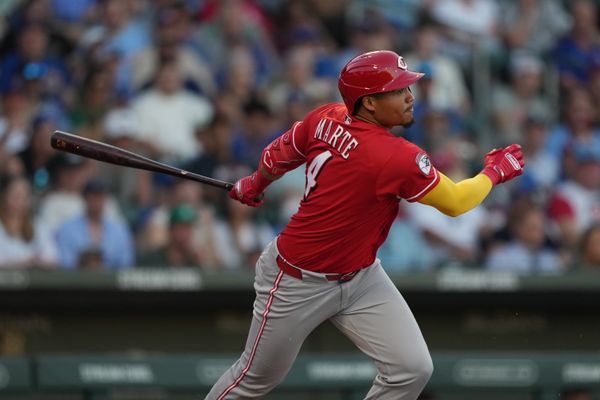 Mar 20, 2026; Mesa, Arizona, USA; Cincinnati Reds outfielder Noelvi Marte (4) hits against the Chicago Cubs in the second inning at Sloan Park. Mandatory Credit: Rick Scuteri-Imagn Images