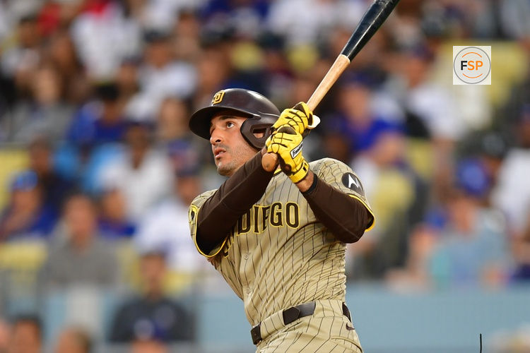 Aug 15, 2025; Los Angeles, California, USA;  San Diego Padres outfielder Ramon Laureano (5) hits a solo home run against the Los Angeles Dodgers during the second inning at Dodger Stadium. Credit: Gary A. Vasquez-Imagn Images