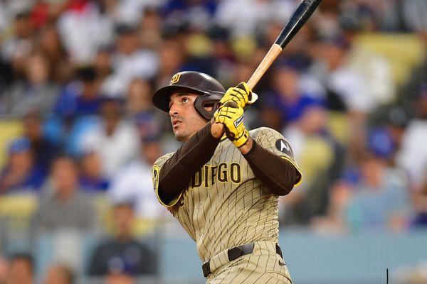 Aug 15, 2025; Los Angeles, California, USA;  San Diego Padres outfielder Ramon Laureano (5) hits a solo home run against the Los Angeles Dodgers during the second inning at Dodger Stadium. Mandatory Credit: Gary A. Vasquez-Imagn Images