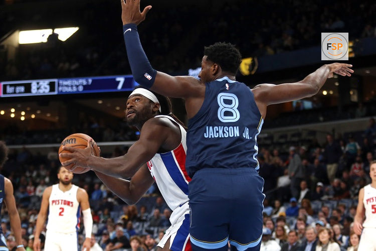 Nov 3, 2025; Memphis, Tennessee, USA; Detroit Pistons forward Isaiah Stewart (28) spins toward the basket as Memphis Grizzlies forward/center Jaren Jackson Jr. (8) defends during the first quarter at FedExForum. Credit: Petre Thomas-Imagn Images