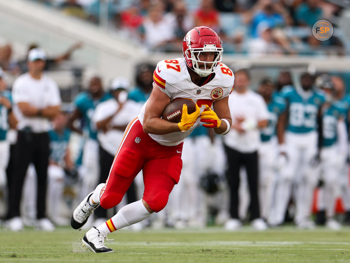 Aug 10, 2024; Jacksonville, Florida, USA; Kansas City Chiefs tight end Travis Kelce (87) runs with the ball against the Jacksonville Jaguars in the first quarter during preseason at EverBank Stadium. Credit: Nathan Ray Seebeck-USA TODAY Sports