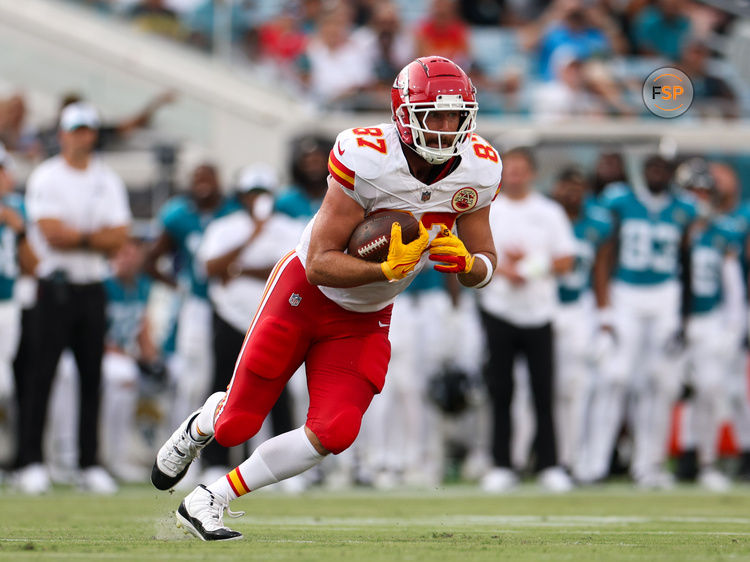 Aug 10, 2024; Jacksonville, Florida, USA; Kansas City Chiefs tight end Travis Kelce (87) runs with the ball against the Jacksonville Jaguars in the first quarter during preseason at EverBank Stadium. Credit: Nathan Ray Seebeck-USA TODAY Sports