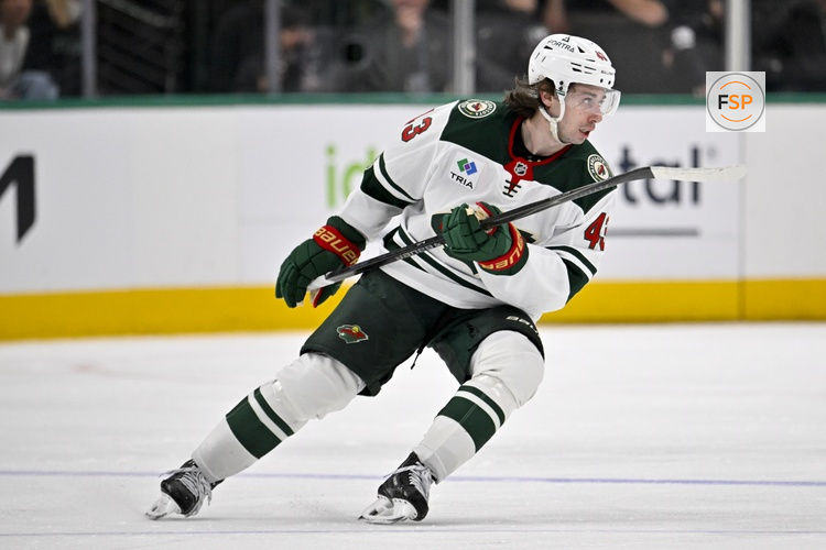 Apr 9, 2026; Dallas, Texas, USA; Minnesota Wild defenseman Quinn Hughes (43) skates against the Dallas Stars during the game between the Stars and the Wild at American Airlines Center. Credit: Jerome Miron-Imagn Images