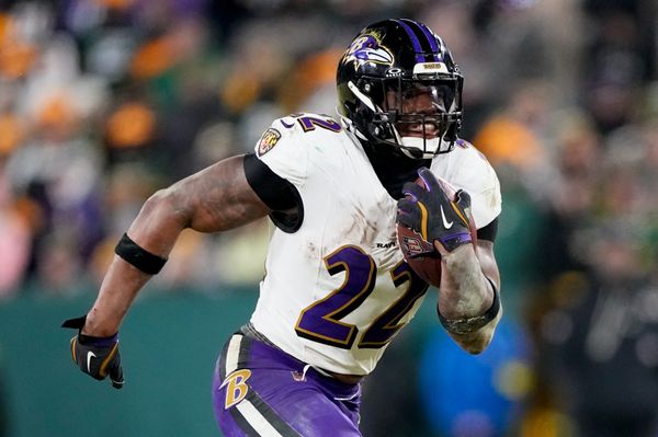 Dec 27, 2025; Green Bay, Wisconsin, USA; Baltimore Ravens running back Derrick Henry (22) runs for a touchdown during the fourth quarter against the Green Bay Packers at Lambeau Field. Mandatory Credit: Jeff Hanisch-Imagn Images