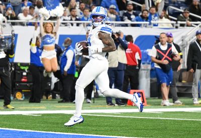 Dec 4, 2025; Detroit, Michigan, USA; Detroit Lions running back Jahmyr Gibbs (0) scores a touchdown during the second half against the Dallas Cowboys at Ford Field. Mandatory Credit: Lon Horwedel-Imagn Images