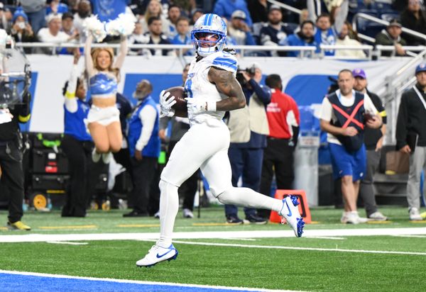 Dec 4, 2025; Detroit, Michigan, USA; Detroit Lions running back Jahmyr Gibbs (0) scores a touchdown during the second half against the Dallas Cowboys at Ford Field. Mandatory Credit: Lon Horwedel-Imagn Images