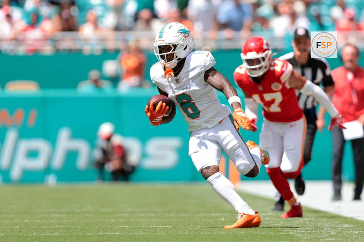 Sep 27, 2026; Miami Gardens, Florida, USA;  Miami Dolphins wide receiver Malik Washington (6) runs with the ball against the Kansas City Chiefs during the first quarter at Hard Rock Stadium.  Credit: Sam Navarro-Imagn Images