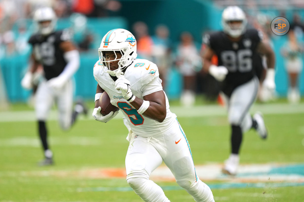 Nov 17, 2024; Miami Gardens, Florida, USA; Miami Dolphins tight end Jonnu Smith (9) breaks free for a touchdown late in the fourth quarter against the Las Vegas Raiders at Hard Rock Stadium. Credit: Jim Rassol-Imagn Images