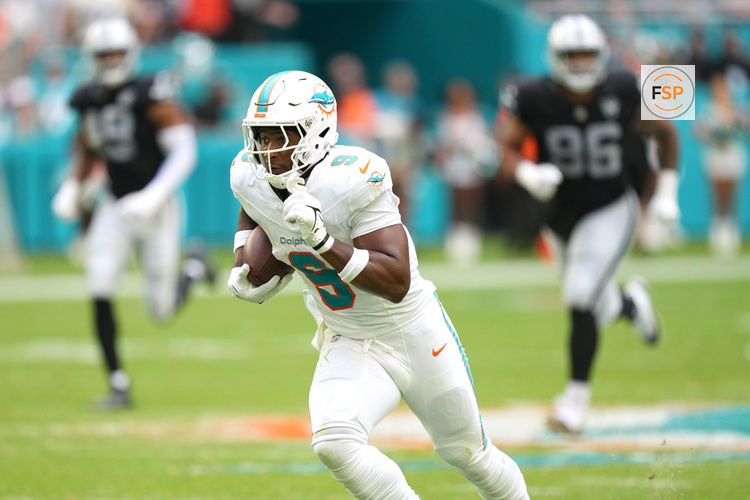 Nov 17, 2024; Miami Gardens, Florida, USA; Miami Dolphins tight end Jonnu Smith (9) breaks free for a touchdown late in the fourth quarter against the Las Vegas Raiders at Hard Rock Stadium. Credit: Jim Rassol-Imagn Images