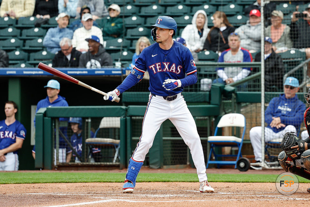 SURPRISE, AZ - MARCH 07:  Texas Rangers outfielder Evan Carter (32) sets up to bat during the MLB spring training baseball game between the Arizona Diamondbacks and the Texas Rangers on March 7, 2024 at Surprise Stadium in Surprise, Arizona. (Photo by Kevin Abele/Icon Sportswire)
