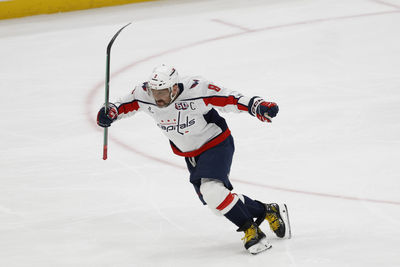 Apr 6, 2025; Elmont, New York, USA;  Washington Capitals left wing Alex Ovechkin (8) scores a goal in the 2nd period against the New York Islanders at UBS Arena. The goal is the 895th of Ovechkin’s career, breaking the NHL all-time career goals record previously held by Wayne Gretzky.at UBS Arena. Mandatory Credit: Geoff Burke-Imagn Images