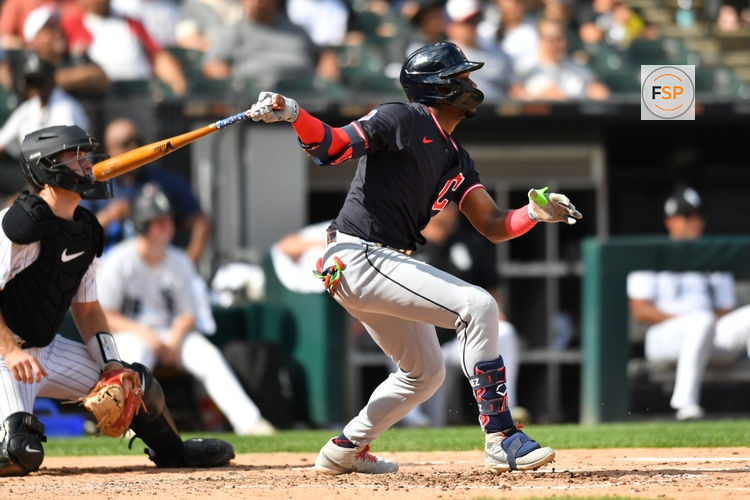 Jul 12, 2025; Chicago, Illinois, USA; Cleveland Guardians center fielder Angel Martinez (1) hits a sacrifice RBI during the fourth inning against the Chicago White Sox at Rate Field. Credit: Patrick Gorski-Imagn Images