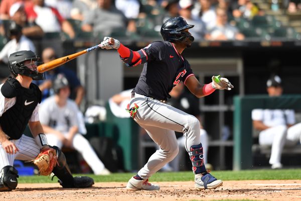 Jul 12, 2025; Chicago, Illinois, USA; Cleveland Guardians center fielder Angel Martinez (1) hits a sacrifice RBI during the fourth inning against the Chicago White Sox at Rate Field. Mandatory Credit: Patrick Gorski-Imagn Images