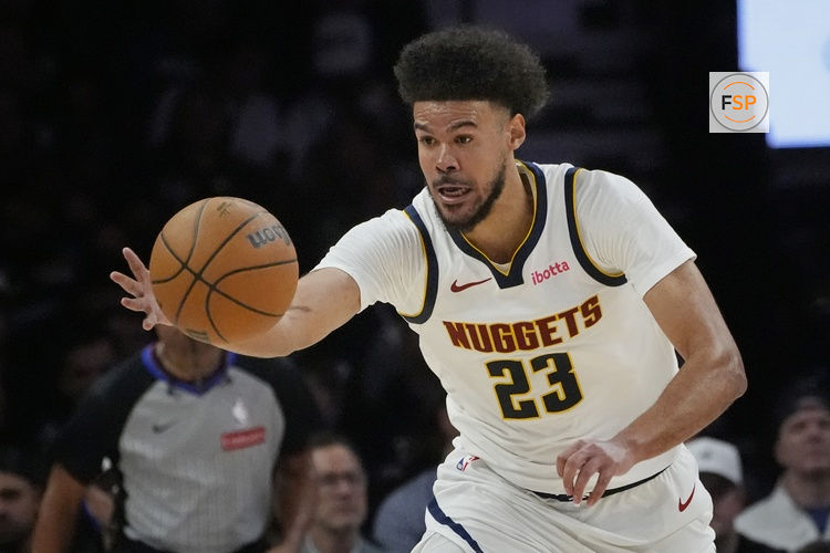 Apr 23, 2026; Minneapolis, Minnesota, USA; Denver Nuggets forward Cameron Johnson (23) goes after the ball against the Minnesota Timberwolves in the third quarter at Target Center. Credit: Bruce Kluckhohn-Imagn Images