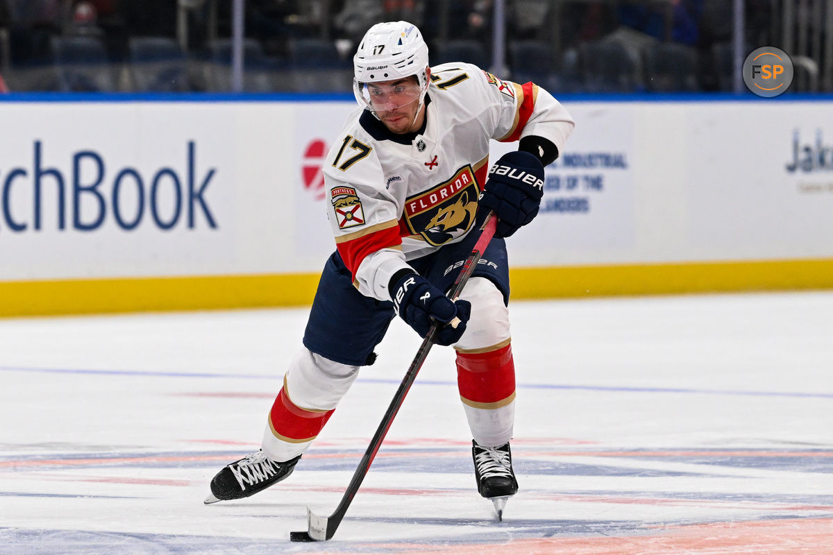 Oct 26, 2024; Elmont, New York, USA;  Florida Panthers center Evan Rodrigues (17) skates across center ice against the New York Islanders during the first period at UBS Arena. Credit: Dennis Schneidler-Imagn Images