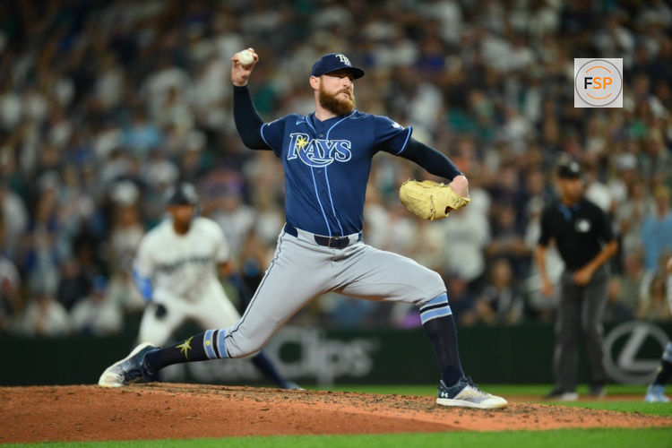 Aug 8, 2026; Seattle, Washington, USA; Tampa Bay Rays relief pitcher Bryan Baker (47) pitches to the Seattle Mariners during the ninth inning at T-Mobile Park. Credit: Steven Bisig-Imagn Images